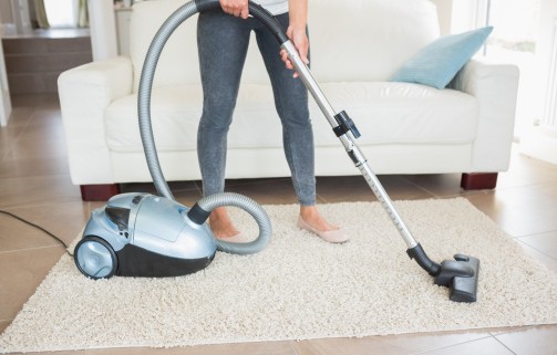 Woman hovering rug